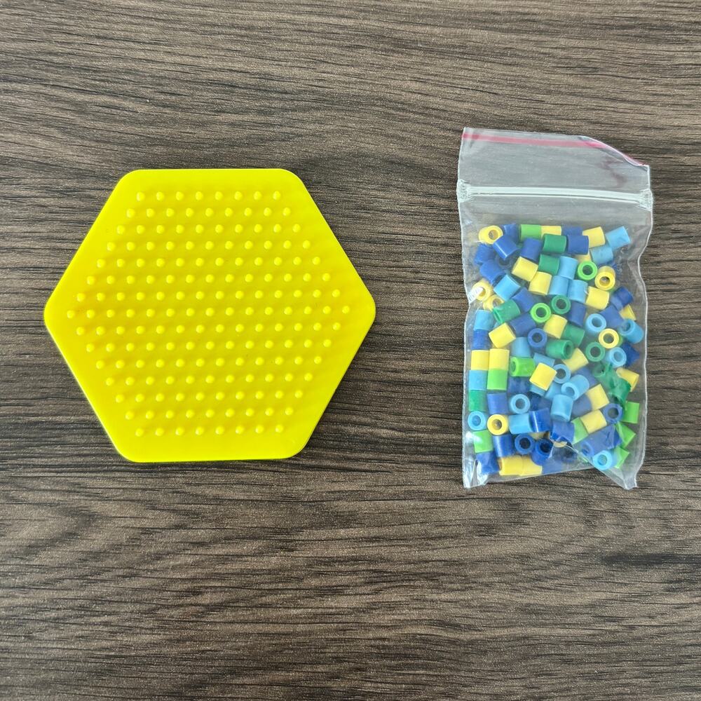 Perler Fuse Bead Peg Board Hexagon with Blue Green Yellow Beads Pegboard